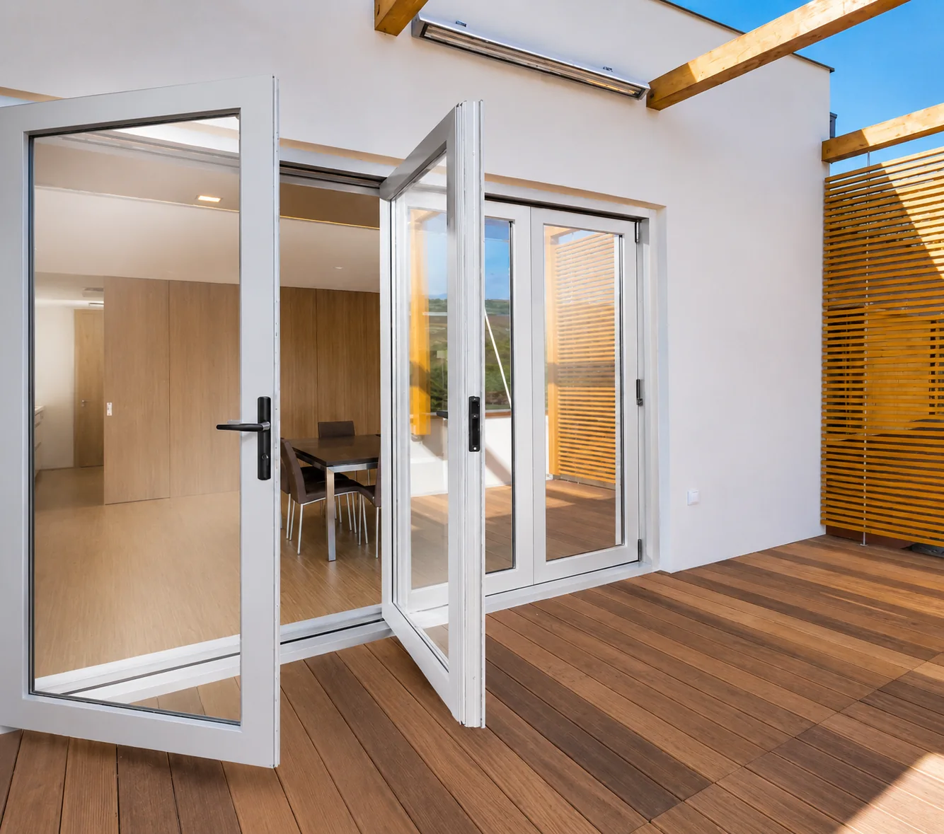 White folding sliding door opening onto a balcony