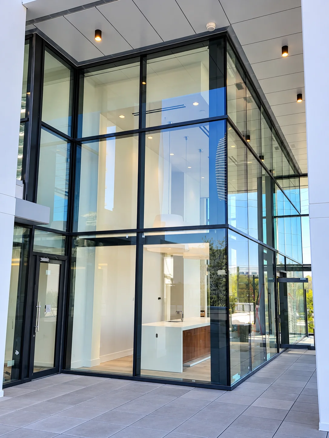 Tailor by Marcon: Close view of the glazed corner and adjacent door.