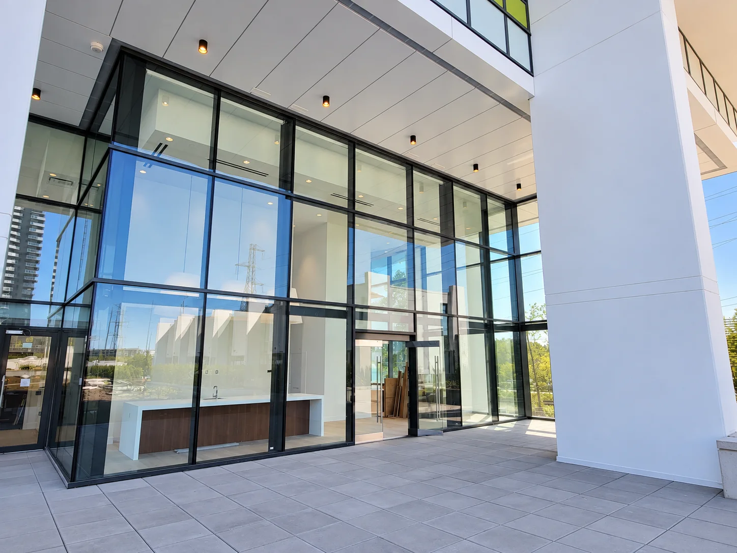 Tailor by Marcon: Lobby corner and entrance beneath the covered approach.
